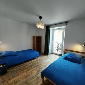 Ένα ή περισσότερα κρεβάτια σε δωμάτιο στο Versant Sud - Duplex - Centre Bourg d 'Oisans