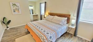 a bedroom with a bed and a window at Bay View Great Deck Pool 2 levels & 3 bedr condo in South Padre Island