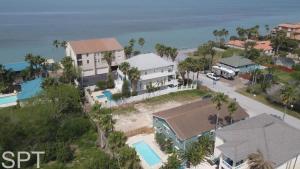 an aerial view of a house and the ocean at Large 3 bedr Bay Views Pool Great Deck condo in South Padre Island +112 photos