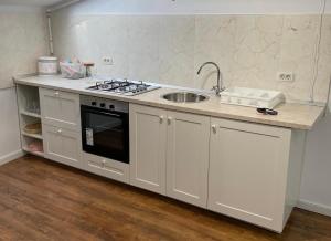 Η κουζίνα ή μικρή κουζίνα στο Dare Apartments