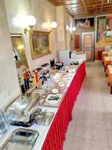 a long buffet line in a restaurant with food at Rooms and apartments PALMA B&B in Medulin