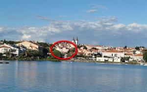 a red circle in the middle of a body of water at Rooms and apartments PALMA B&B in Medulin
