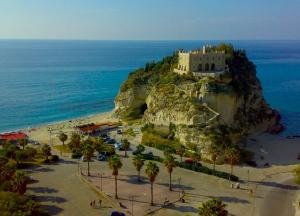 an island with a castle on top of a mountain at Mare e relax in Tropea