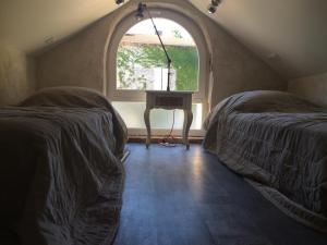 Katil atau katil-katil dalam bilik di Domaine d'AROMM
