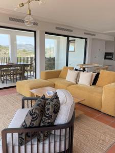 a living room with two couches and a table at Luxury Casa-Saltwater Pool 6x12m in Alginet