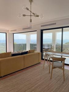 a living room with a couch and a table at Luxury Casa-Saltwater Pool 6x12m in Alginet