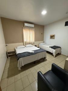 Postel nebo postele na pokoji v ubytování Bravo City Hotel Presidente Prudente