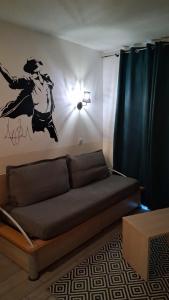 a living room with a couch in a room at Disneyland Paris your perfect stay in Serris