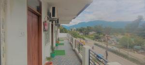 a balcony of a building with a view of a street at Prem Home Stay in Rishīkesh
