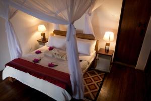 Ένα ή περισσότερα κρεβάτια σε δωμάτιο στο Mandarina Beach House