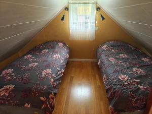 a bedroom with a bed in a tent at Hustugu Gård in Örsundsbro
