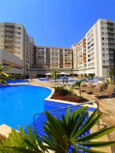 a large swimming pool in front of some buildings at Park Veredas - Flat 216 in Rio Quente +10 photos