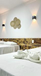 Postel nebo postele na pokoji v ubytování Pousada Villa Mar Porto - Em frente as piscinas naturais