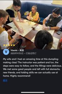 a group of people sitting around a table at Happy Dragon Courtyard Hotel Beijing Forbidden City Lama Temple in Beijing +110 photos