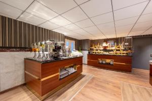 a room with a counter with glasses on it at Grand Plaza Badr Al Maqam Fully Renovated in Al Madinah