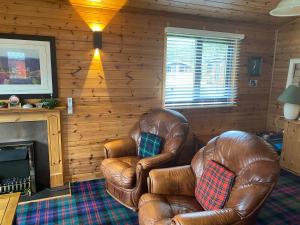 Posezení v ubytování Cozy Loch Lomond Lodge 27, Rowardennan + 28 fotografií