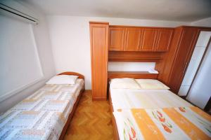 Rooms Novaković客房内的一张或多张床位