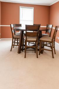 a dining room with a table and chairs at Lawrence RIdge in Adamstown +17 photos