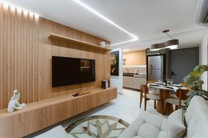 TV a/nebo společenská místnost v ubytování Jardins Almare Apart Hotel
