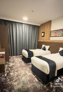 Postel nebo postele na pokoji v ubytování Sudair Karam Hotel - فندق سدير كرم + 14 fotografií