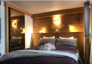 Postel nebo postele na pokoji v ubytování Chalet Rayon de Soleil Gryon Villars