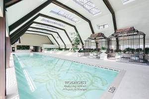 a rendering of a swimming pool in a building at Paxtonz Suites by Wodages in Petaling Jaya