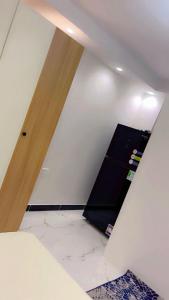 an attic room with a white wall and a door at living Hotel in 6th Of October