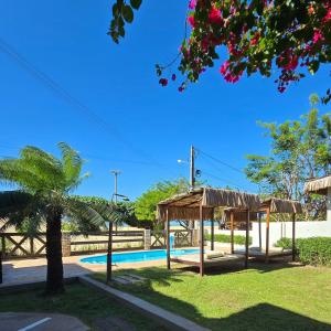 a playground with a pavilion and a swimming pool at Pousada Arte do Velejo by Solarium in São Miguel do Gostoso +89 photos