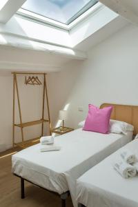 Ένα ή περισσότερα κρεβάτια σε δωμάτιο στο Dimora Caprera - Appartamenti