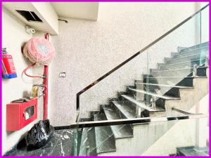 a set of stairs in a building with a fire hydrant at Hotel Gunjan Palace Near Sea Beach And Jagannath Temple - Free Wifi and Parking Facilities - Best Hotel In puri in Puri