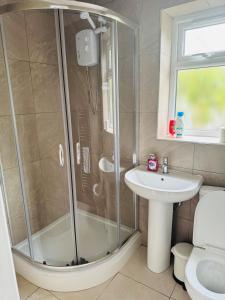 a bathroom with a shower and a sink at 1 bed ground floor flat free parking in Peterborough