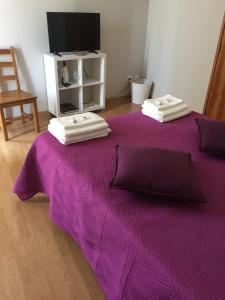 Uma cama ou camas num quarto em Casas do Terreiro