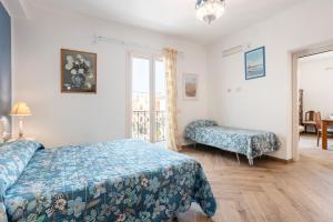 Giường trong phòng chung tại Matilde - Isola delle Femmine