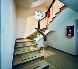 a staircase in a building with a stair case at Apartment in Nueva Córdoba in Cordoba