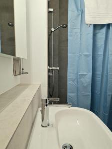 a bathroom with a sink and a shower at Casa Maria Bern in Bern +11 photos