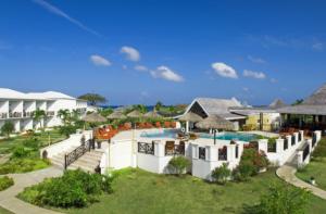 an aerial view of a resort with a swimming pool at Coyaba Beach Resort in Saint Georgeʼs