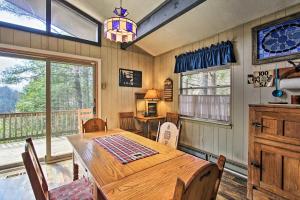 a dining room with a wooden table and chairs at Modern Rustic Cabin - Cozy Forest Escape in Gatlinburg +13 photos
