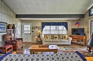 a living room with a couch and a table at Modern Rustic Cabin - Cozy Forest Escape in Gatlinburg