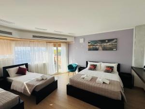 a bedroom with two beds and a window at MMM HOME Train Station 4 in Mestre
