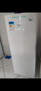 a white refrigerator freezer sitting in a kitchen at Casa Bela Vista in Blumenau