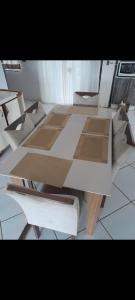a wooden table sitting on top of a floor at Casa Bela Vista in Blumenau