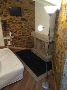 Uma cama ou camas num quarto em Casas do Terreiro