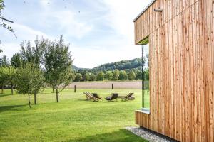 a wooden house with a view of a field at Ferienhaus Weitsicht in Großschönau +80 photos