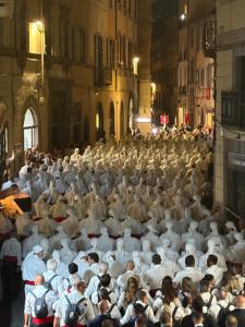 a large group of people dressed in white in a building at Corso Italia 111 guest house in Viterbo
