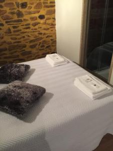 Uma cama ou camas num quarto em Casas do Terreiro