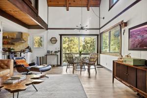 a living room with a table and chairs at TreeLicious Jacuzzi Cozy Chalet close to Slopes in Big Bear Lake