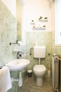 a bathroom with a toilet and a sink at The Loft in Koper +33 photos