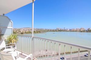 a balcony with a view of the water at RiuRau Home - Studio 50 meters from the beach in Calpe +2 photos