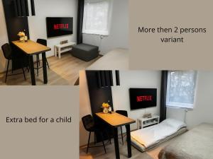 a room with a table with a bed and a tv at Smarty Choice Living with Netflix - Kubánské náměstí in Prague