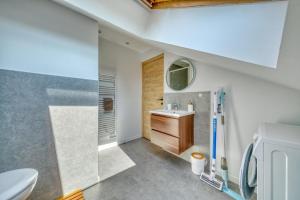 a bathroom with a sink and a toilet at La Résidence Courcelles - Climatisation in Reims +110 photos